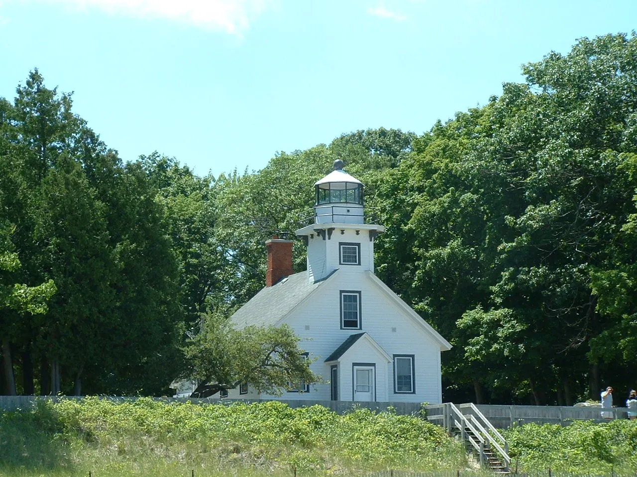 White wooden Mission Point Lighthouse near the tip of Old Mission Peninsula, Traverse City, Michigan
