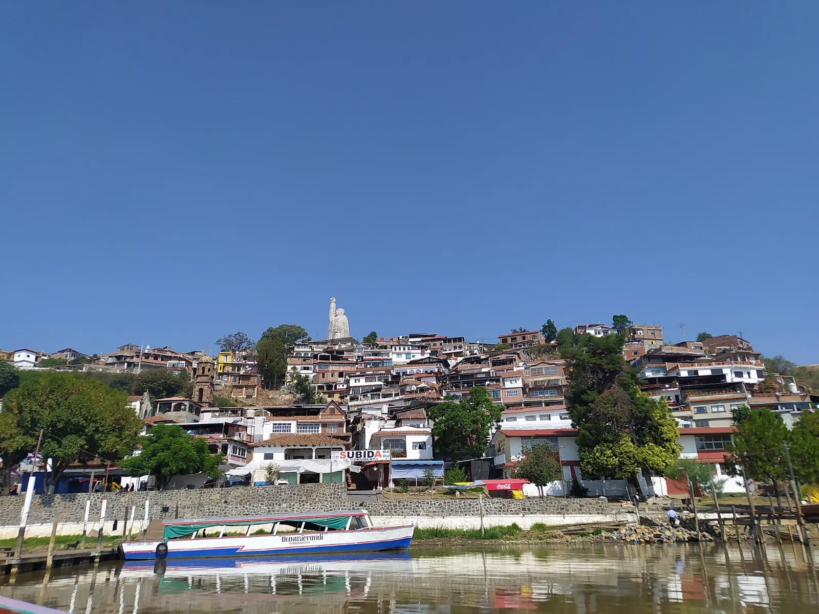 Janitzio island rising from Lake Pátzcuaro with houses on the hillside, Tzintzuntzan, Michoacán