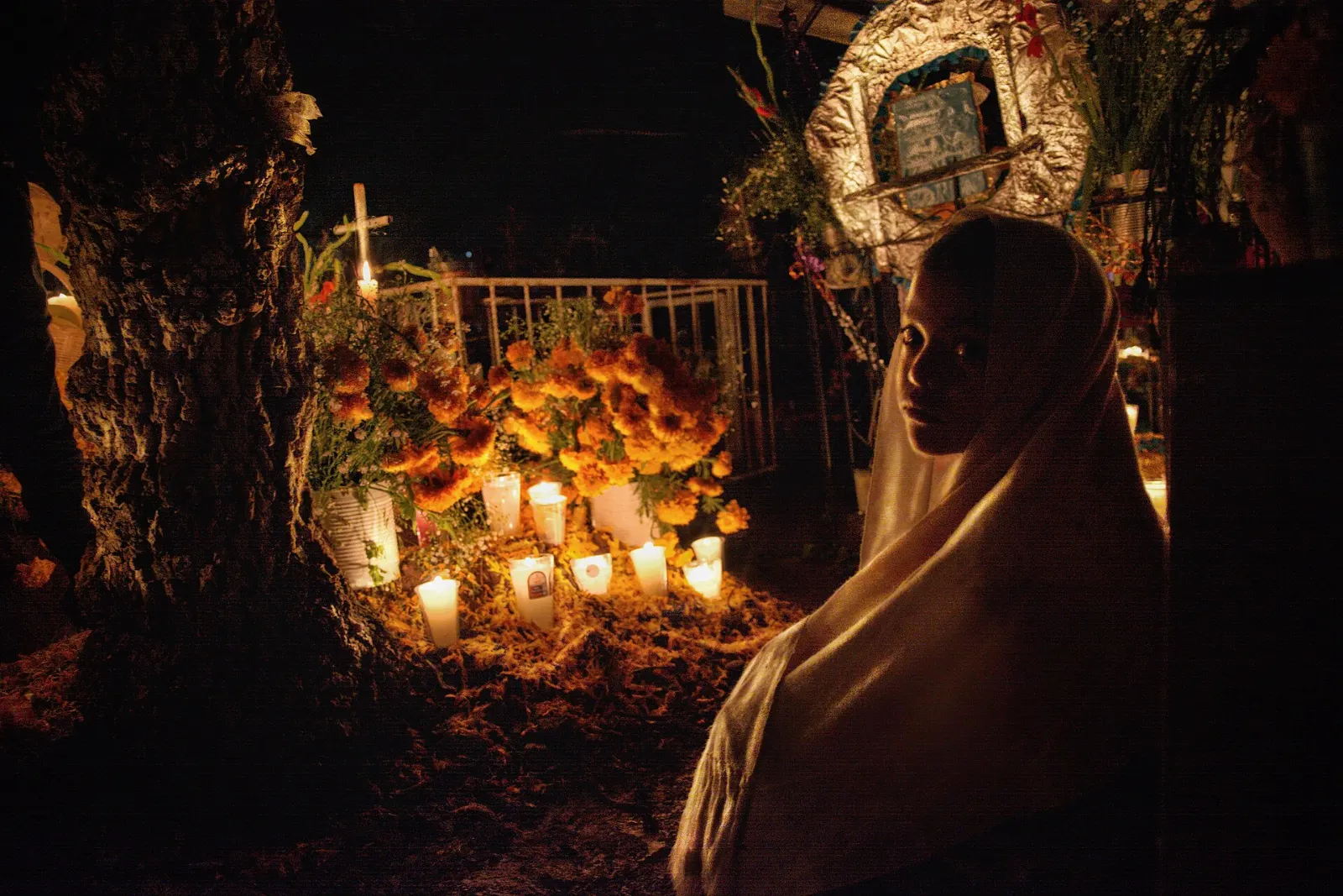 Candlelit graves during Night of the Dead on Lake Pátzcuaro, Tzintzuntzan, Michoacán