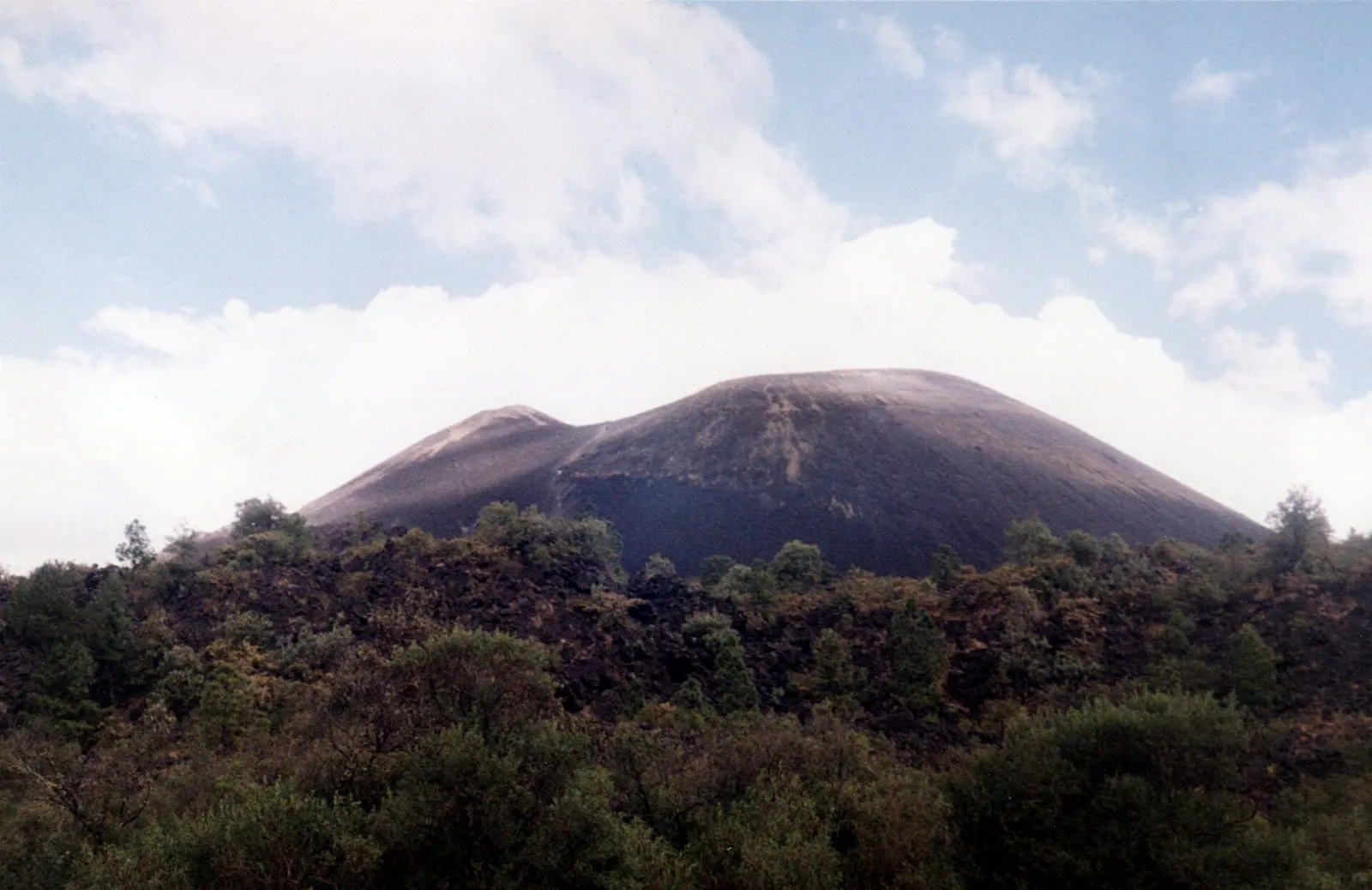 Dark cone of Parícutin volcano rising from lava fields, Uruapan, Michoacán