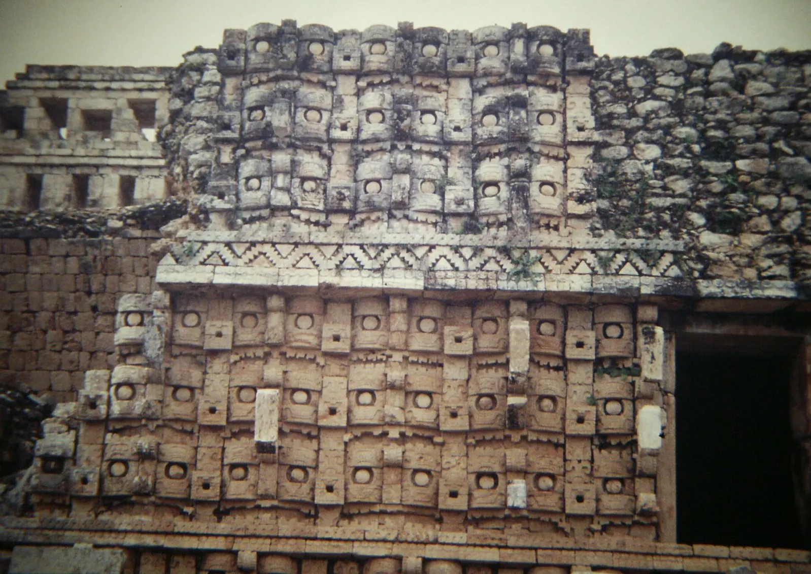 Facade of masks at the Codz Poop temple in Kabah, Uxmal, Yucatán