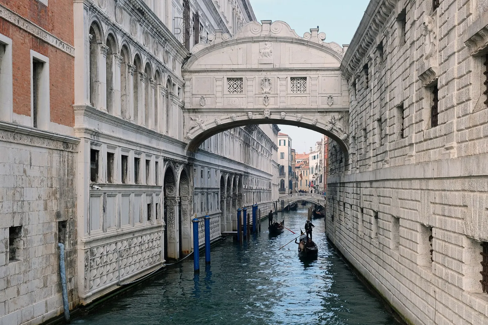 The enclosed white limestone Bridge of Sighs over a narrow canal, Venice, Italy