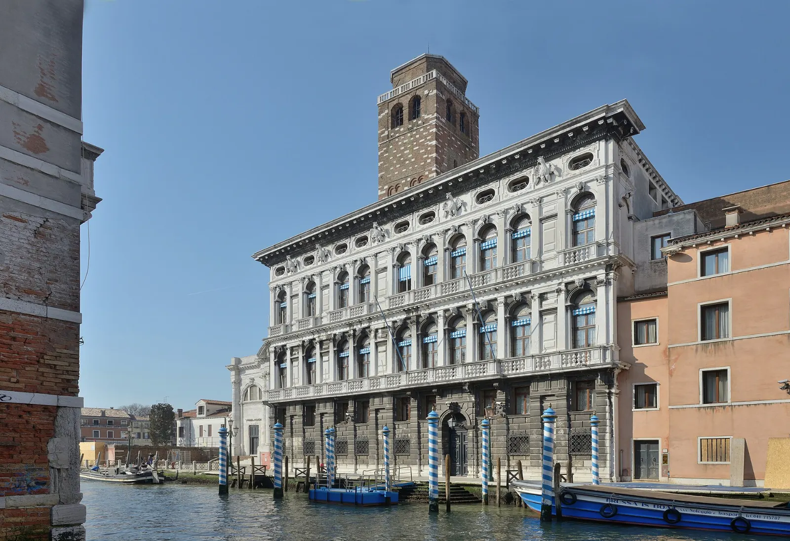 The broad square of Campo del Ghetto Nuovo surrounded by tall residential buildings, Venice, Italy