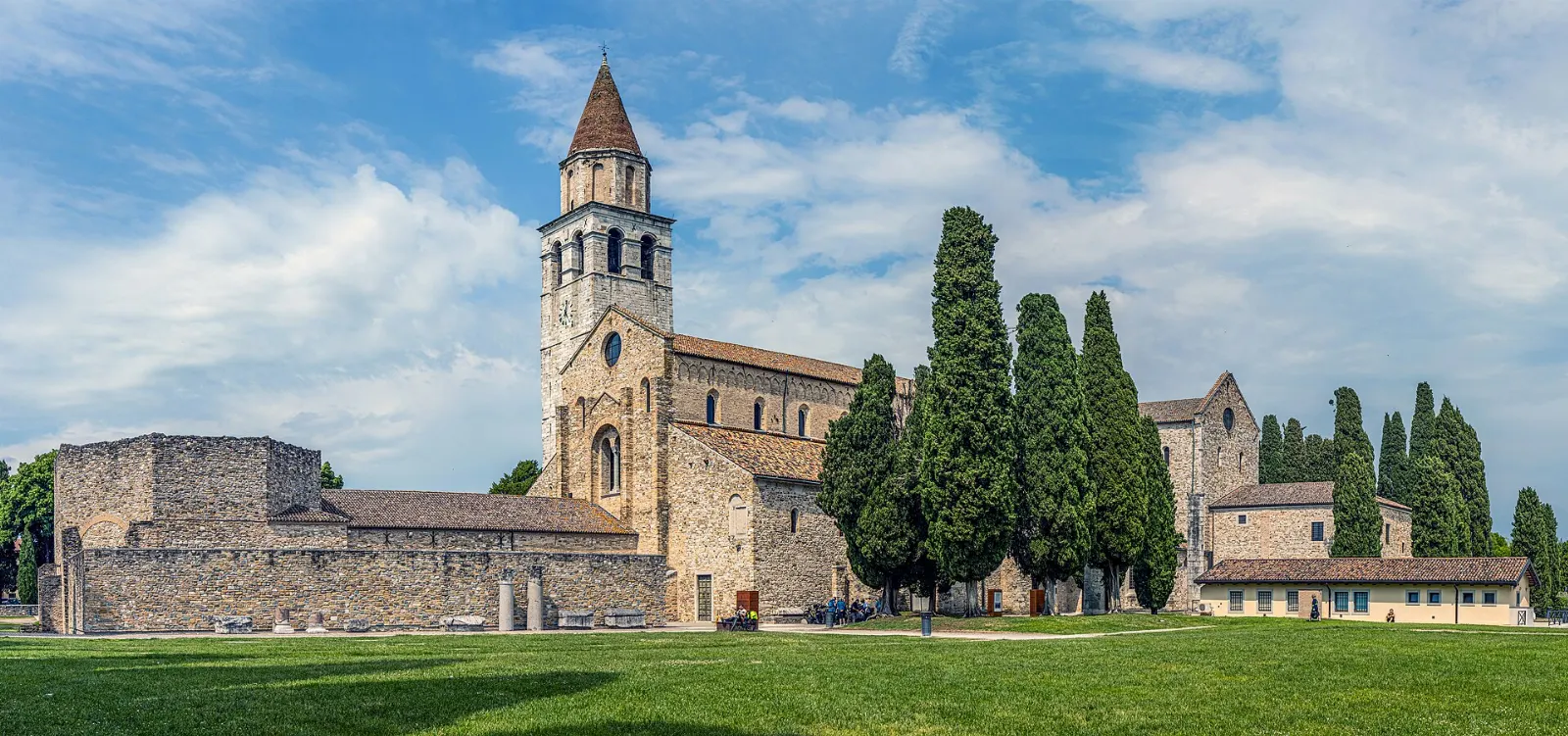 The cathedral and bell tower of Torcello rising over the flat lagoon island, Venice, Italy