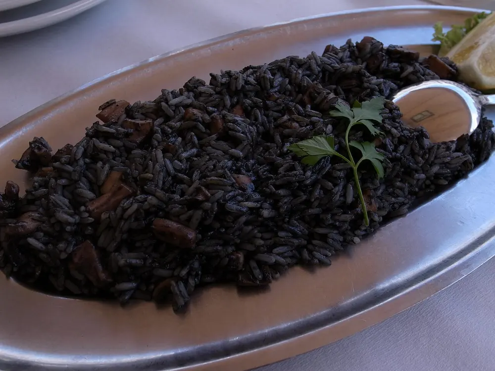 Risotto al nero di seppia in Venice, Italy