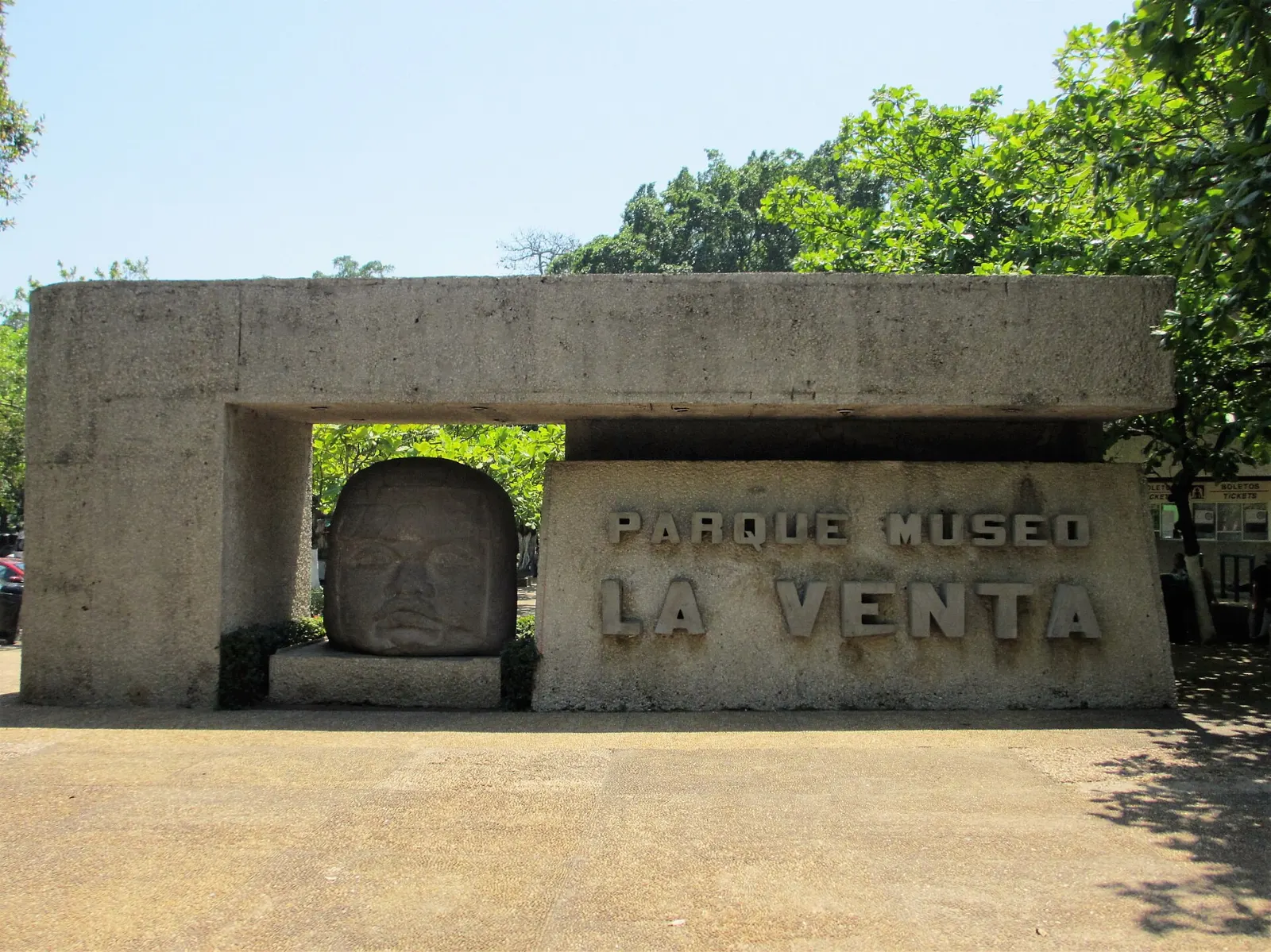 An Olmec colossal head displayed in the jungle setting of Parque Museo La Venta, Villahermosa, Tabasco