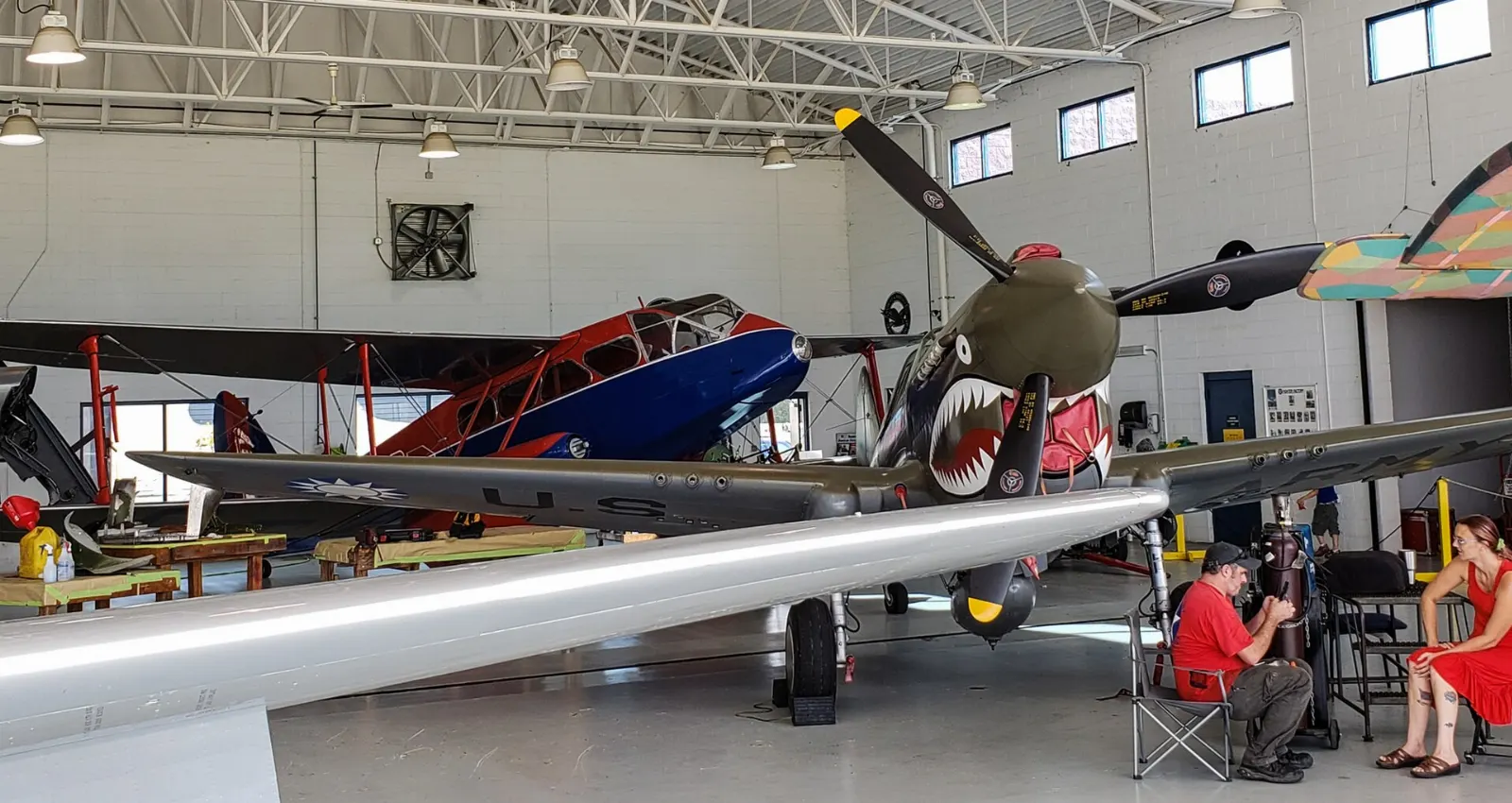 Vintage propeller warplanes parked outside a hangar at the Military Aviation Museum, Virginia Beach, Virginia