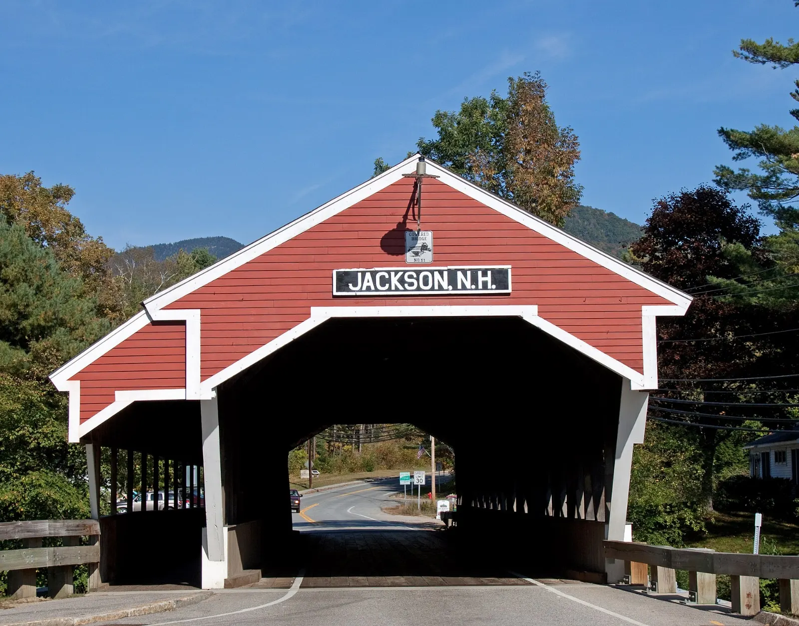 A red covered bridge at the entrance to the village of Jackson, White Mountains, New Hampshire