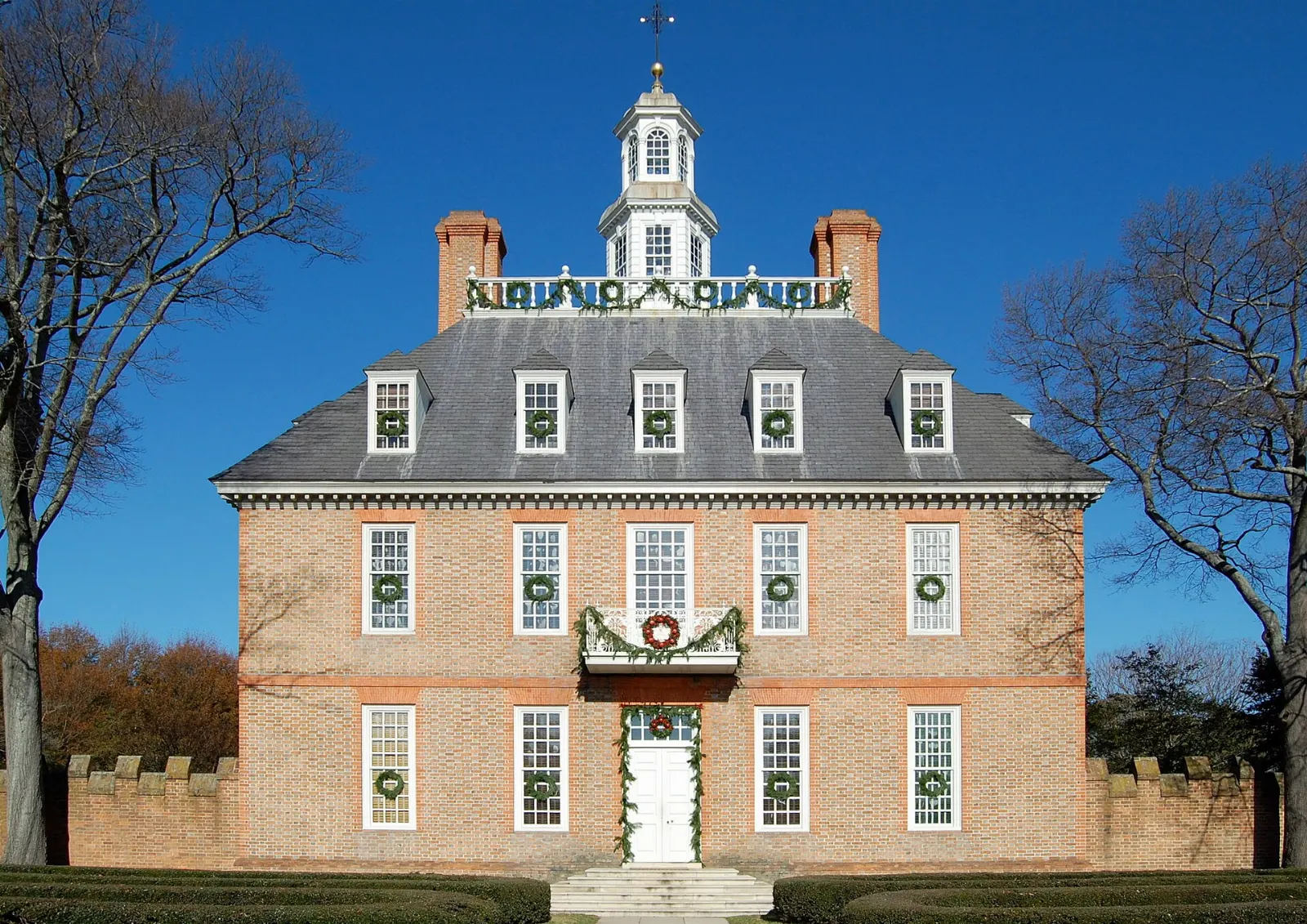 The red-brick Governor's Palace with its cupola at the end of a long green, Williamsburg, Virginia