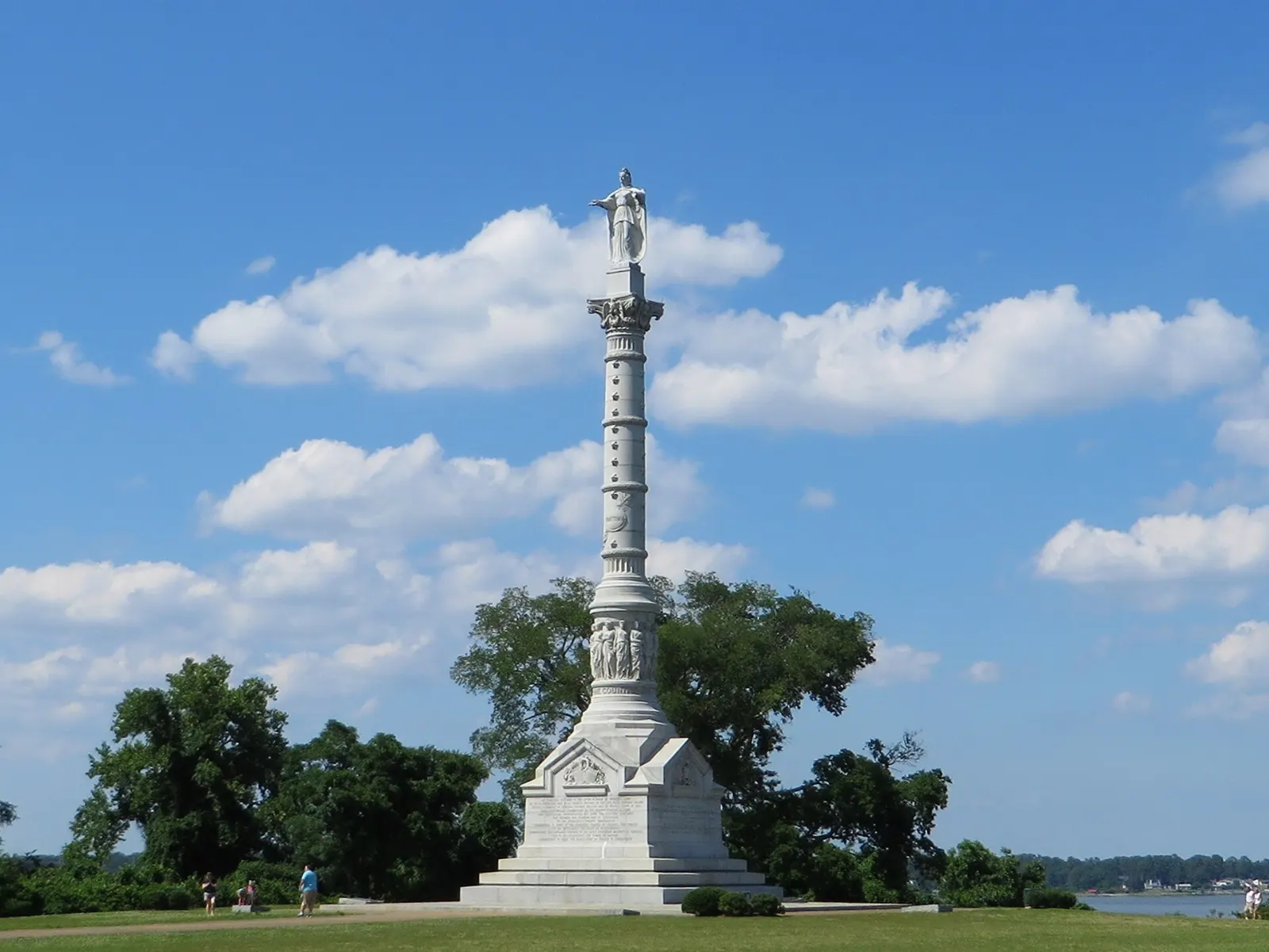 A tall marble column topped by a statue of Liberty overlooking the York River, Williamsburg, Virginia