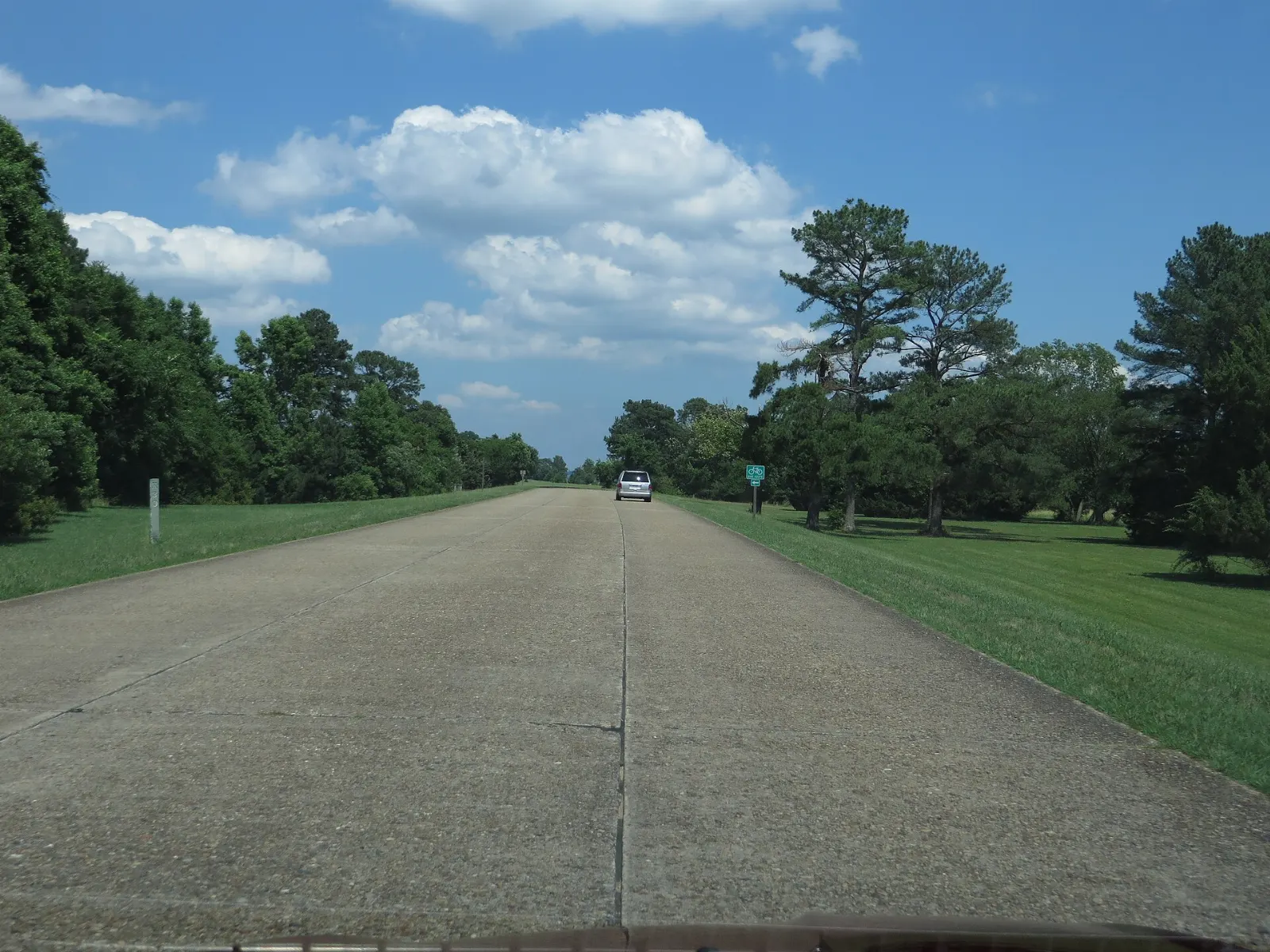 A quiet tree-lined parkway beside the river with brick-aggregate pavement, Williamsburg, Virginia