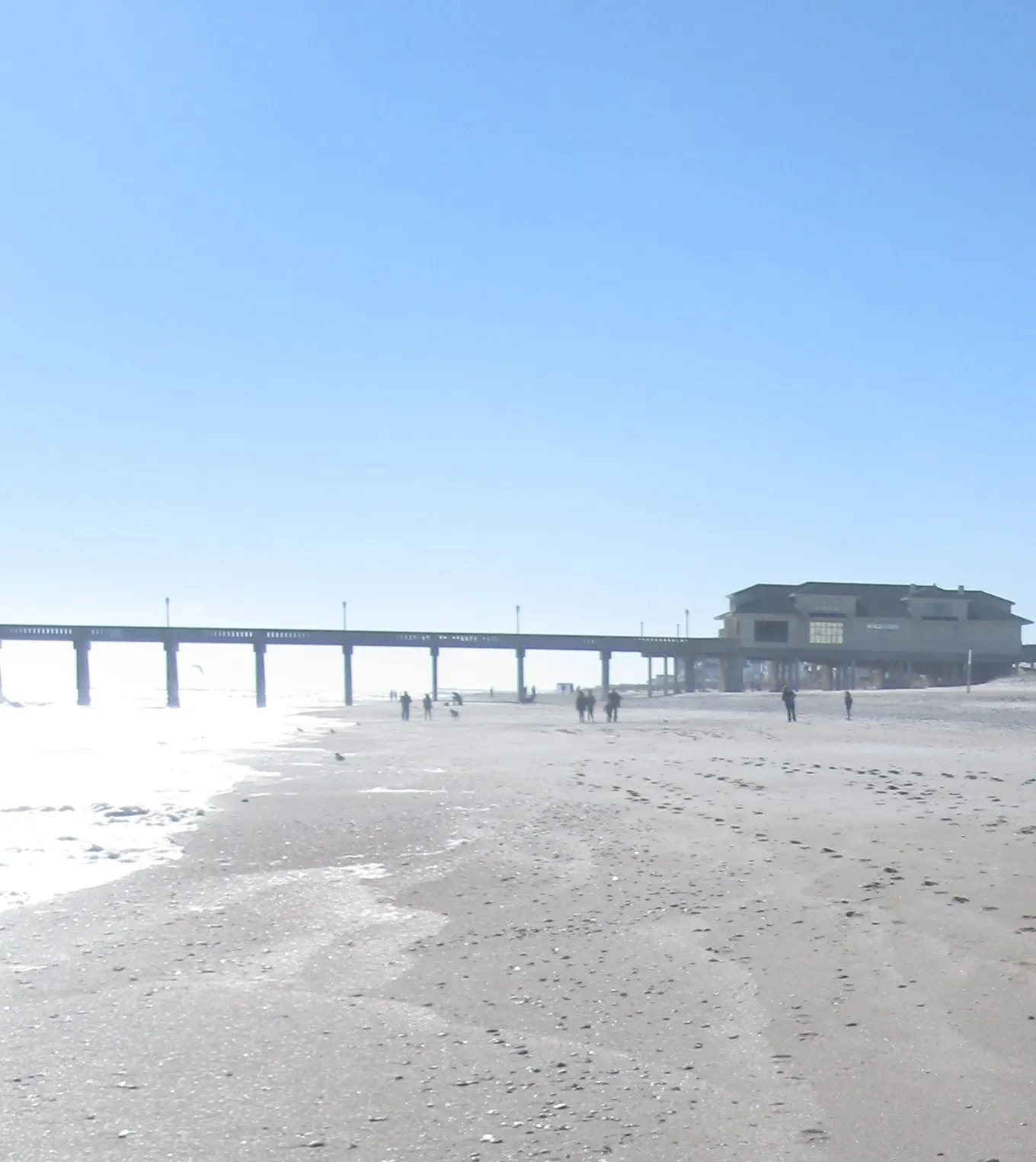 Concrete fishing pier stretching into the Atlantic from Wrightsville Beach, Wilmington, North Carolina