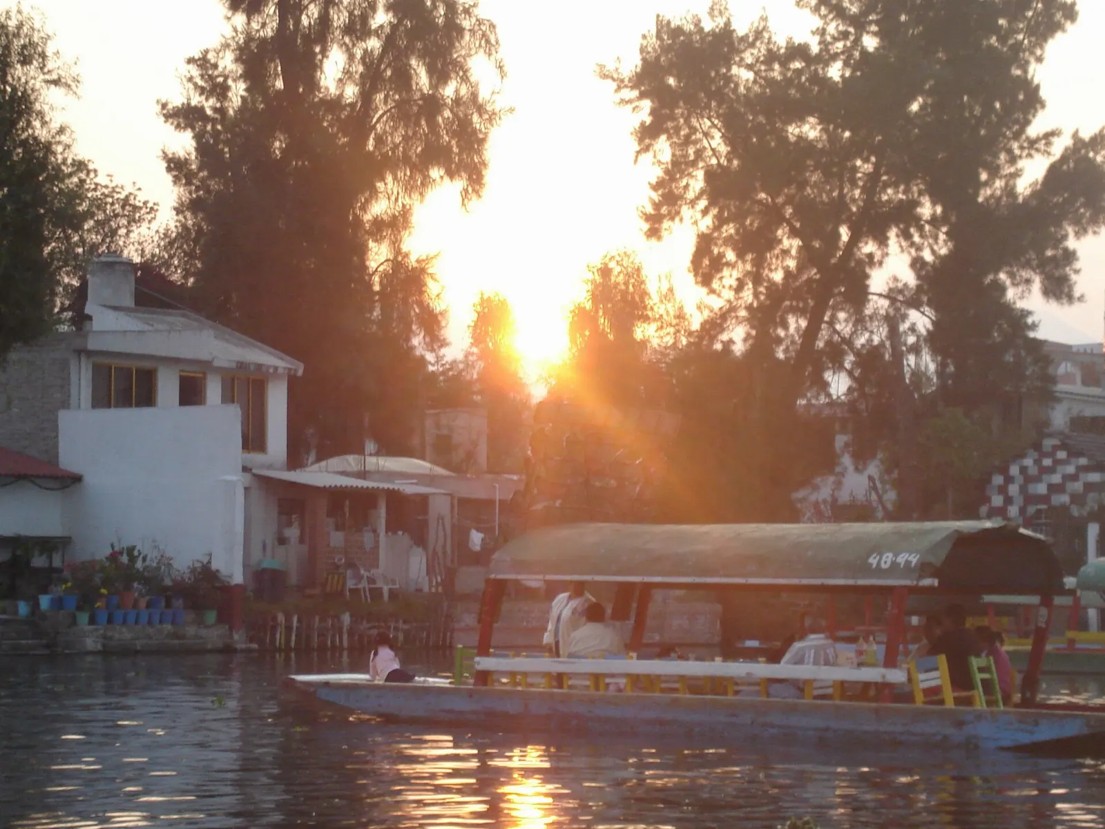 Trajineras moored at the Nativitas embarcadero in Xochimilco, Mexico City