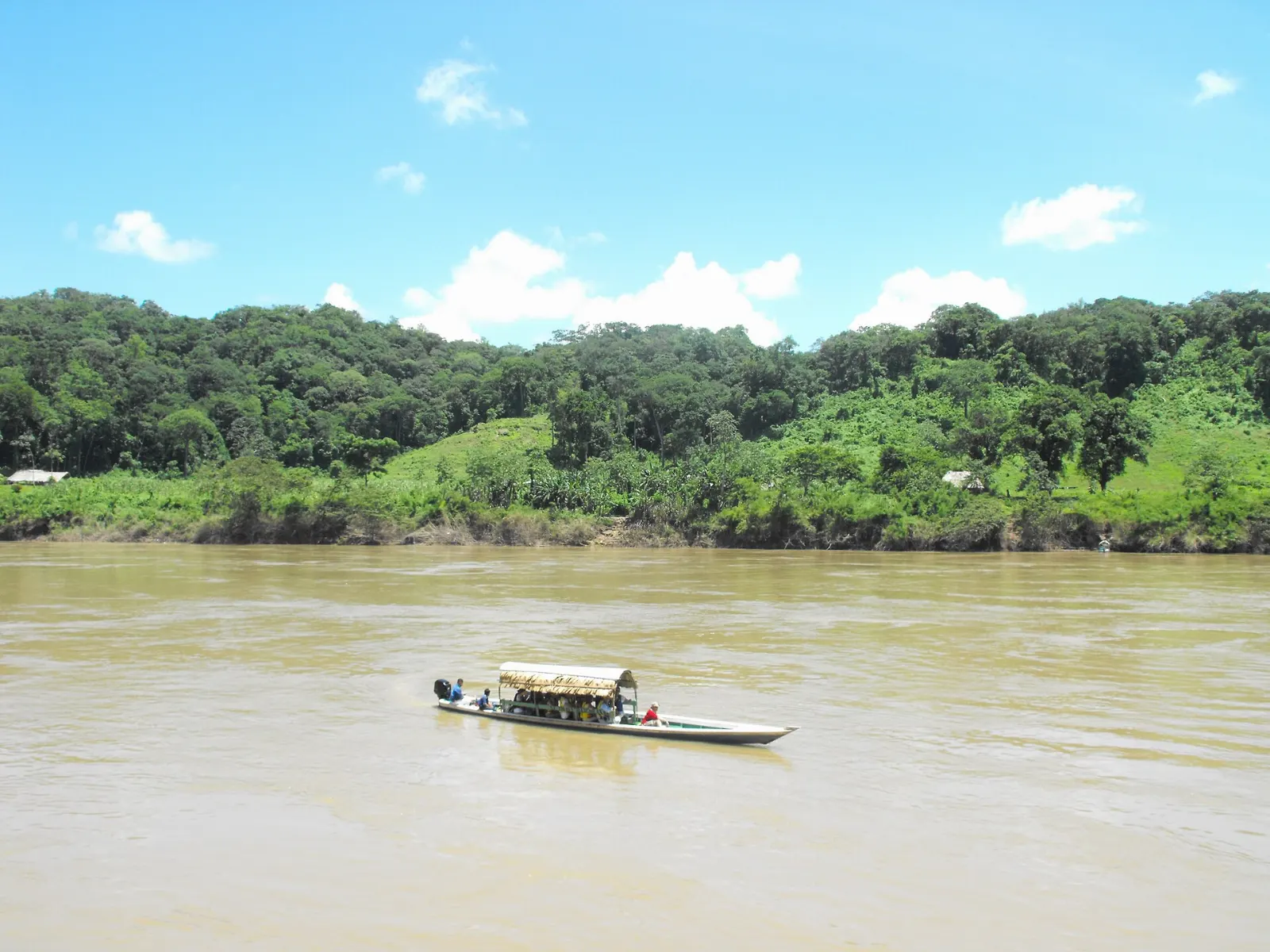 A boat crossing the broad Usumacinta River between Mexico and Guatemala, Yaxchilán, Chiapas