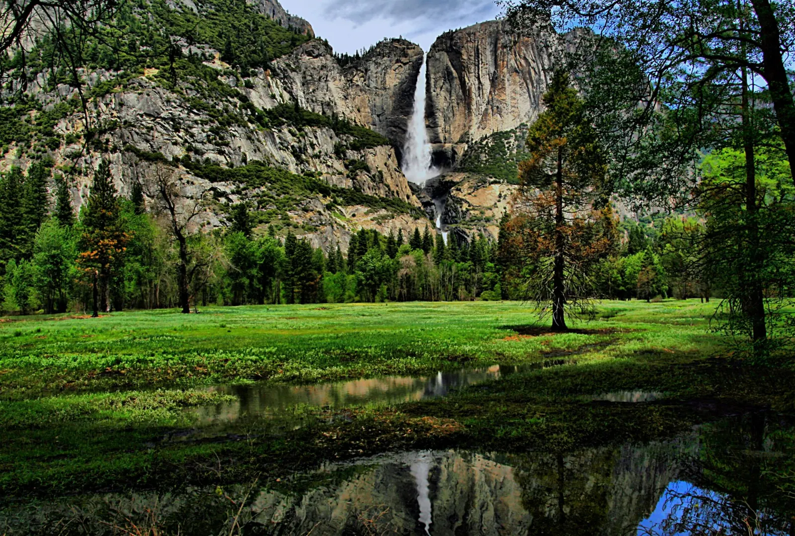 Upper and Lower Yosemite Fall pouring down a granite cliff in spring, Yosemite National Park, California