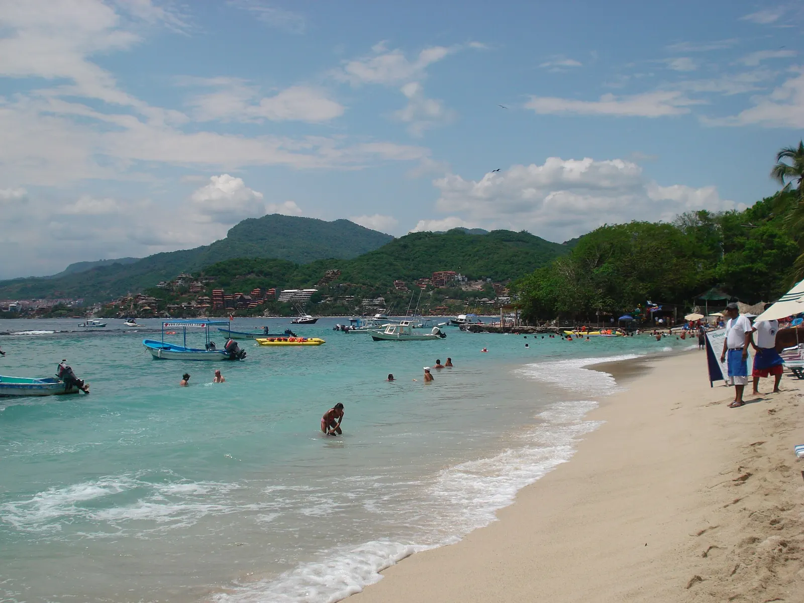 Calm water and palapas at Playa Las Gatas near Zihuatanejo, Guerrero
