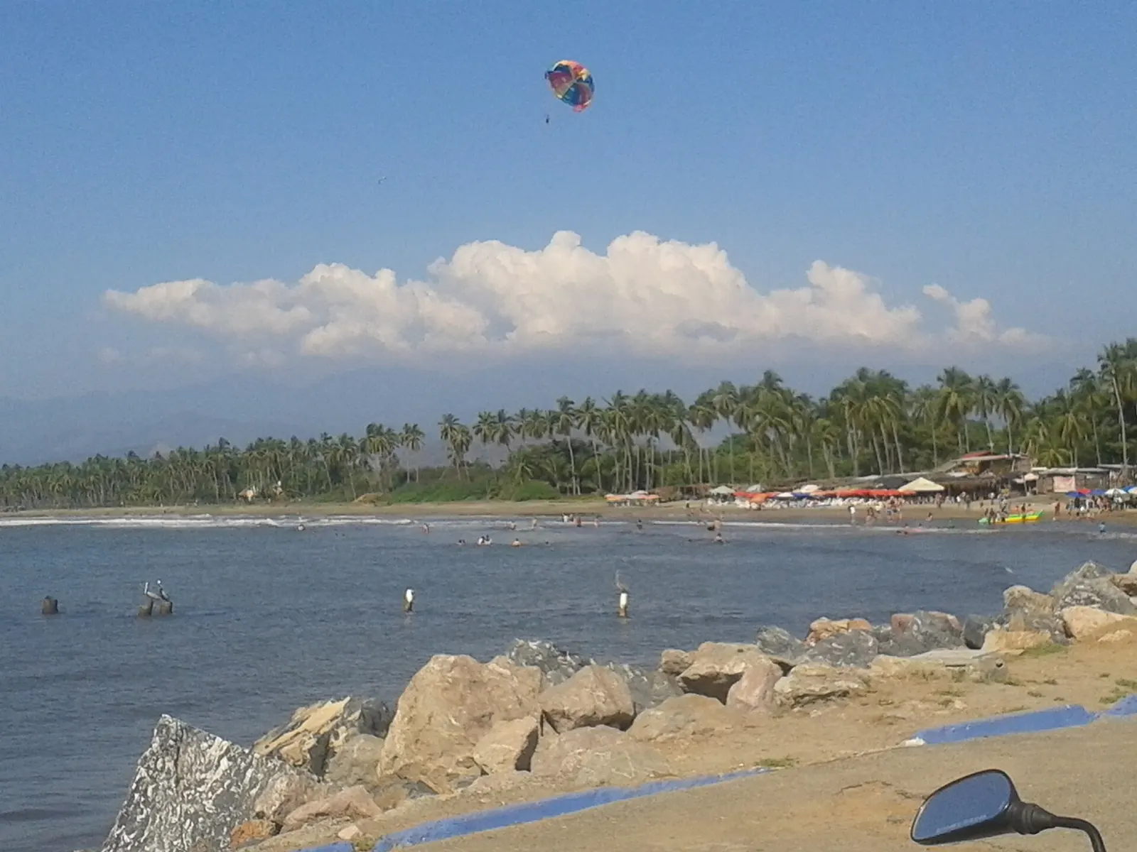 Long sandy beach and waves at Playa Linda in Ixtapa, Zihuatanejo, Guerrero
