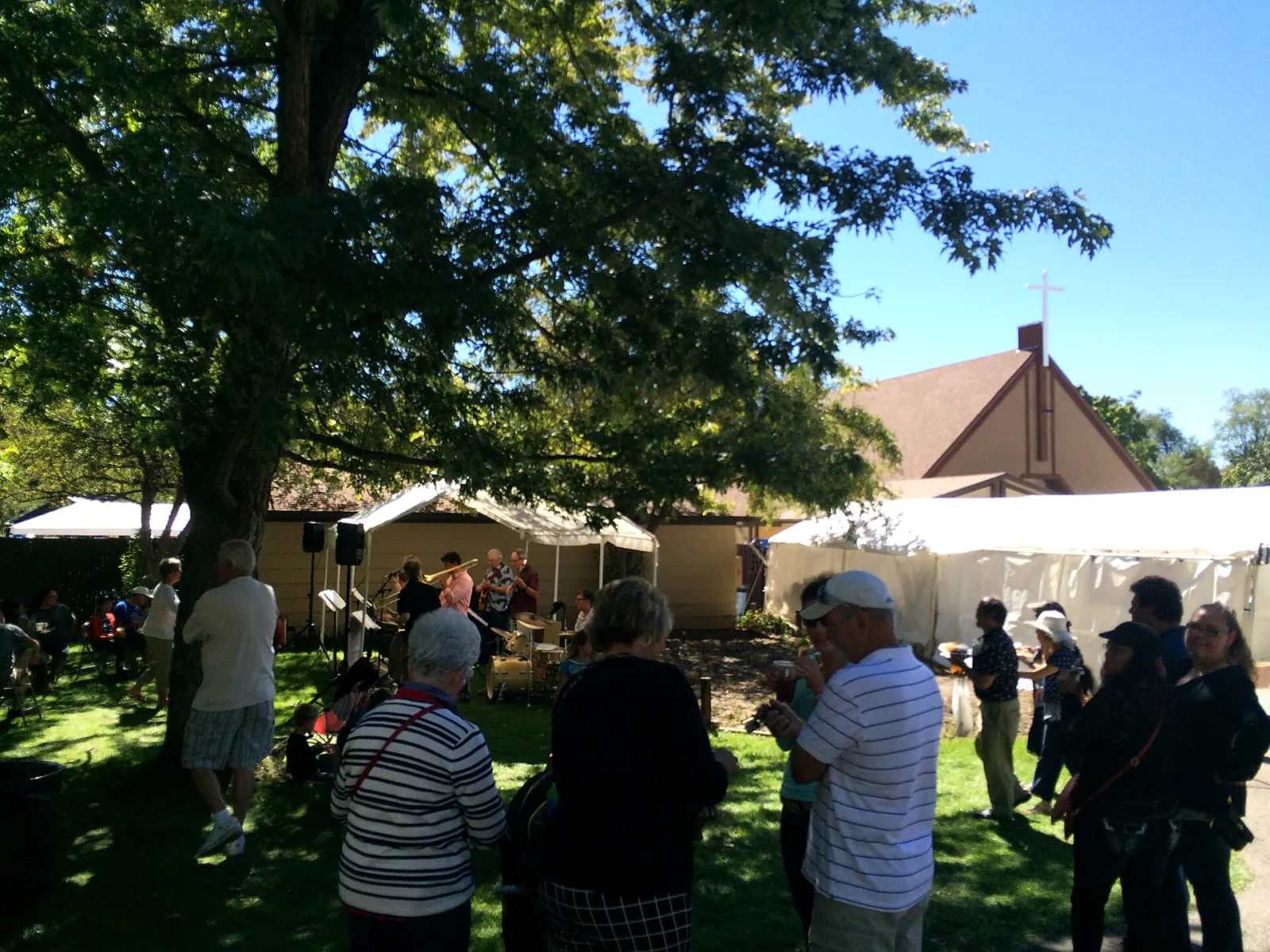 Carmelite Festival 2015 live band with the Carmelite Monastery of Salt Lake City seen in back, Holladay, Utah, United States