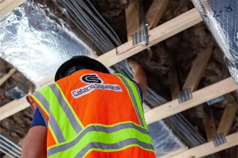 Commercial cable pulling above the ceiling on a Tucson, AZ job site