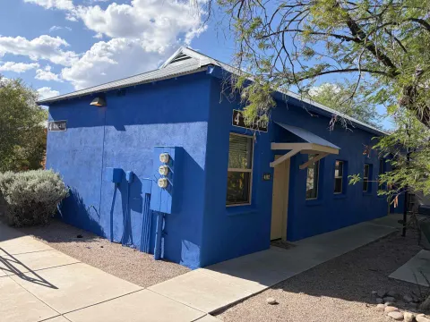 Bold blue stucco and exterior painting by Sunset Coatings in Tucson, AZ