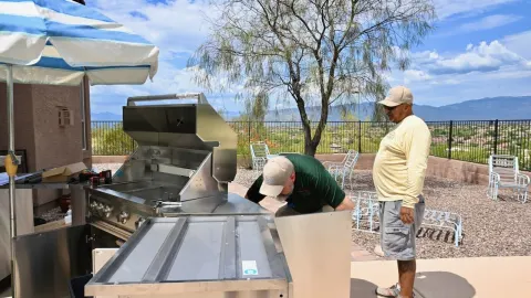 Outdoor kitchen and built-in BBQ grill installation with mountain views in Southern Arizona