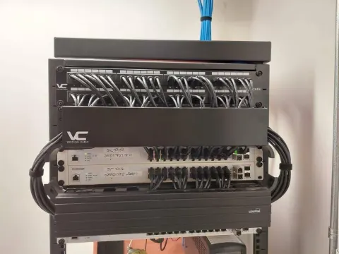 Organized patch panel and structured cabling in a commercial server rack
