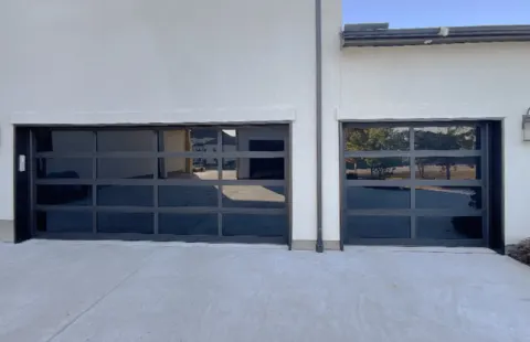 Full-view glass and aluminum garage doors installed in the Phoenix area