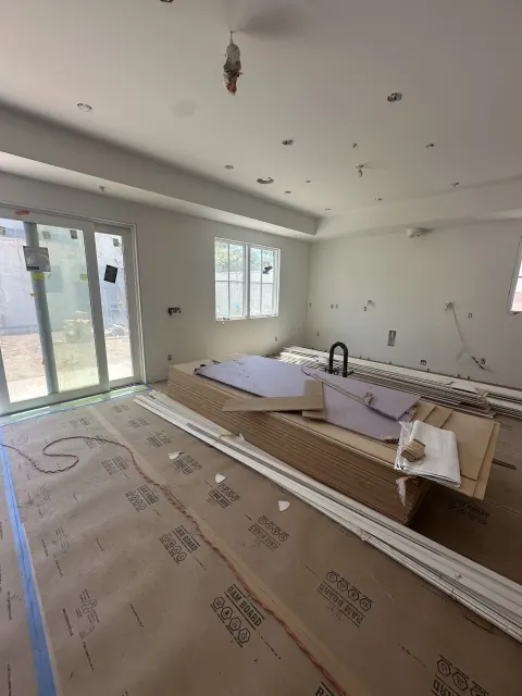 ADU interior build in progress with new windows and sliding doors in Los Angeles, CA