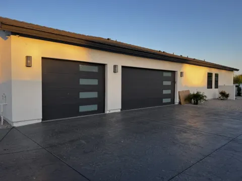 Contemporary garage doors with frosted glass panels in Greater Phoenix