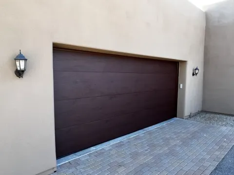 New dark brown garage door installed by A Plus Garage Doors in the Phoenix area