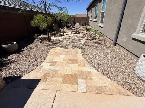 Travertine paver walkway with desert gravel landscaping in Tucson, AZ